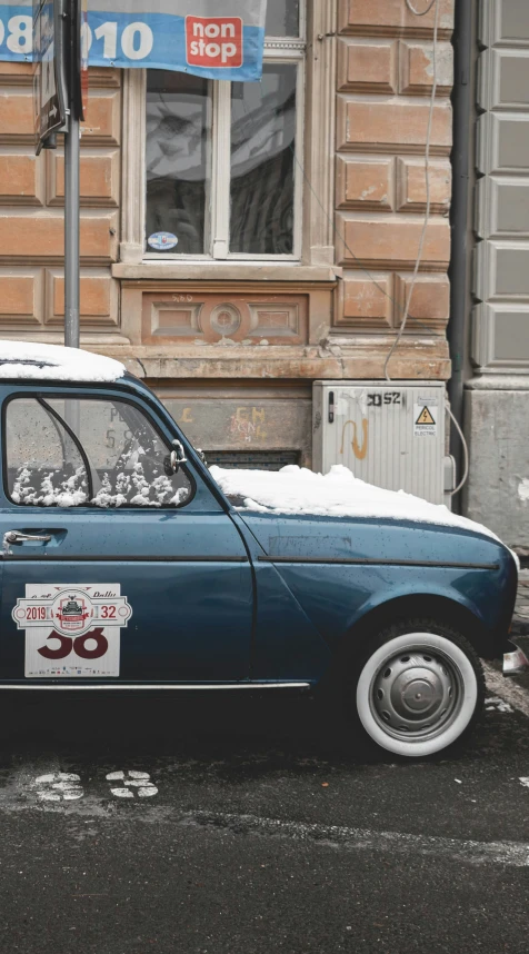 an old style car parked on the side of a street