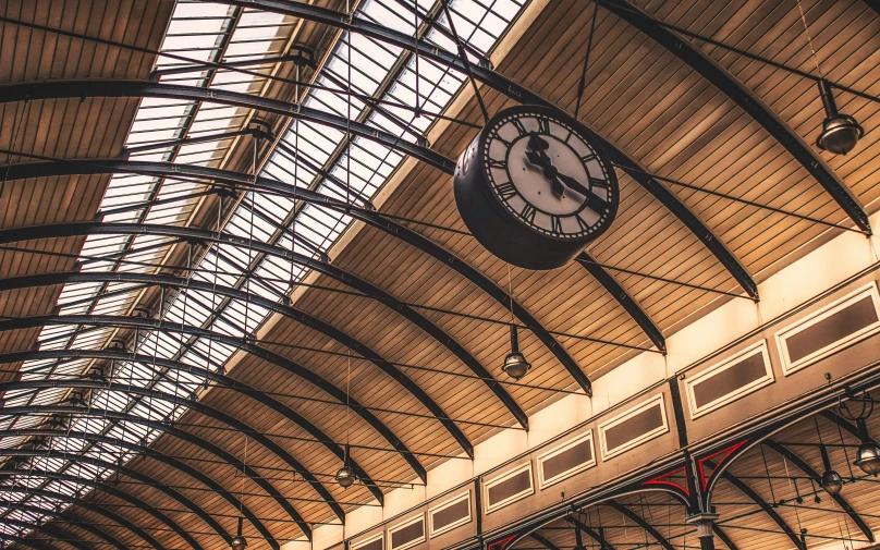 a clock is on the side of the building