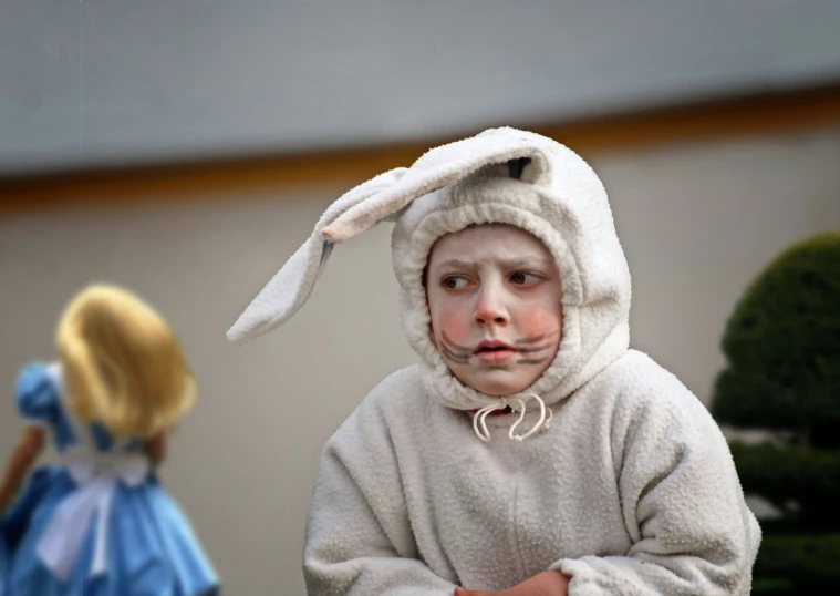 there is a small child in a bunny suit