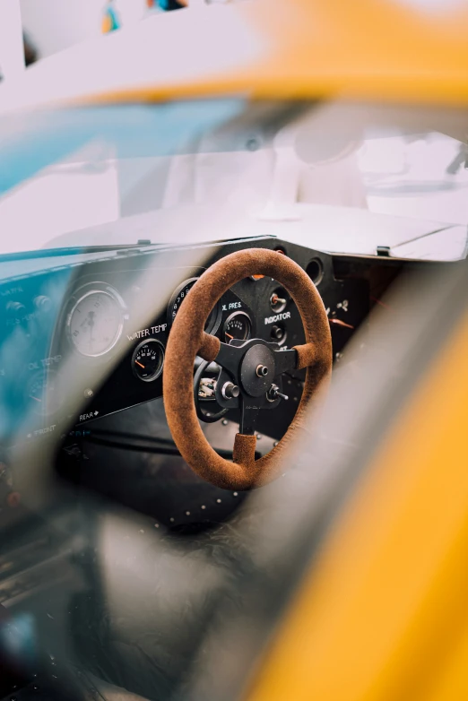 the inside view of a car shows the steering wheel and dashboard