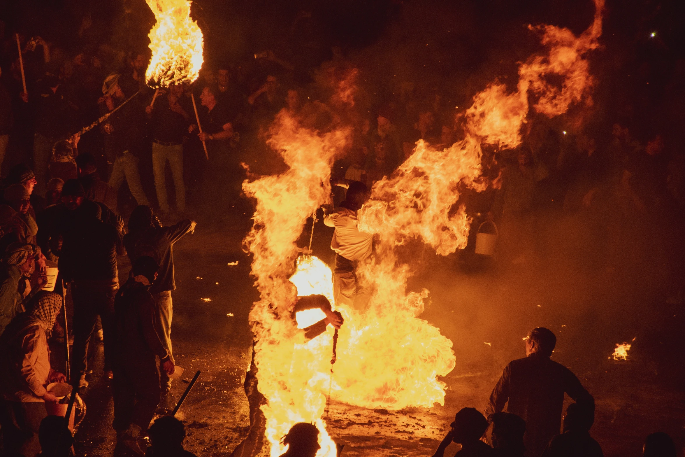 the bonfire is in use and flames are coming out of it