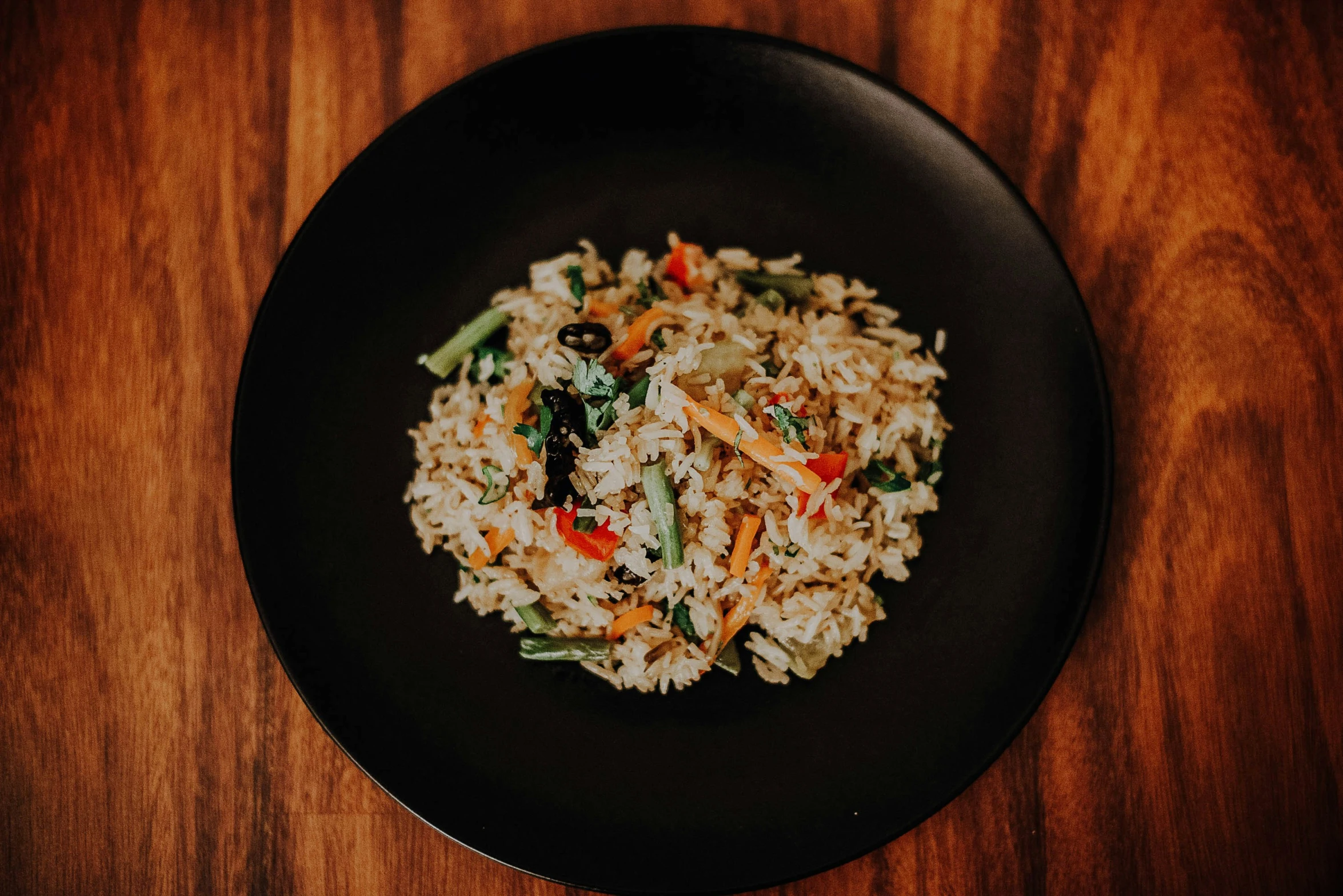 a plate with some rice and vegetables on it