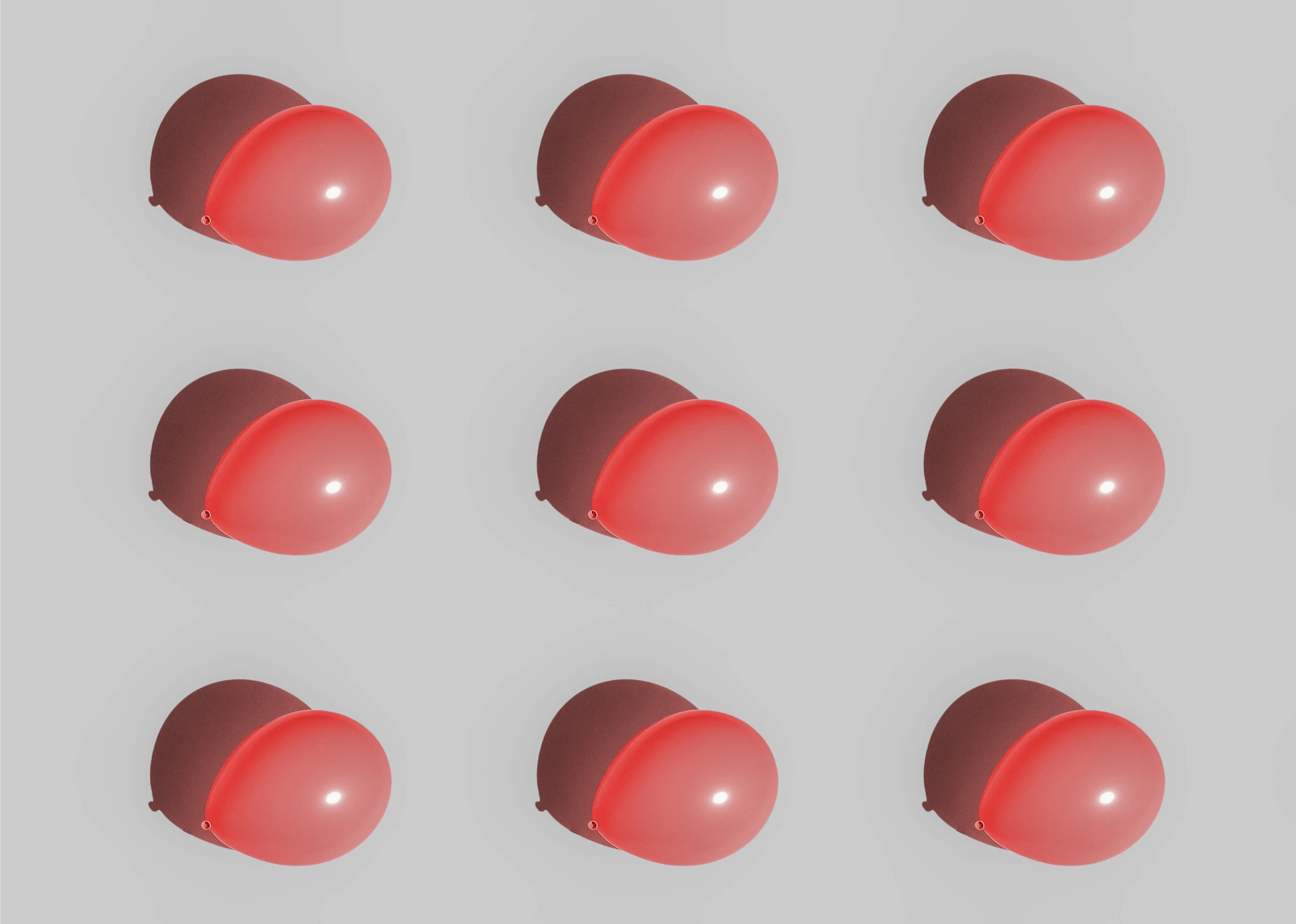 eight red spheres sitting side by side against a white background