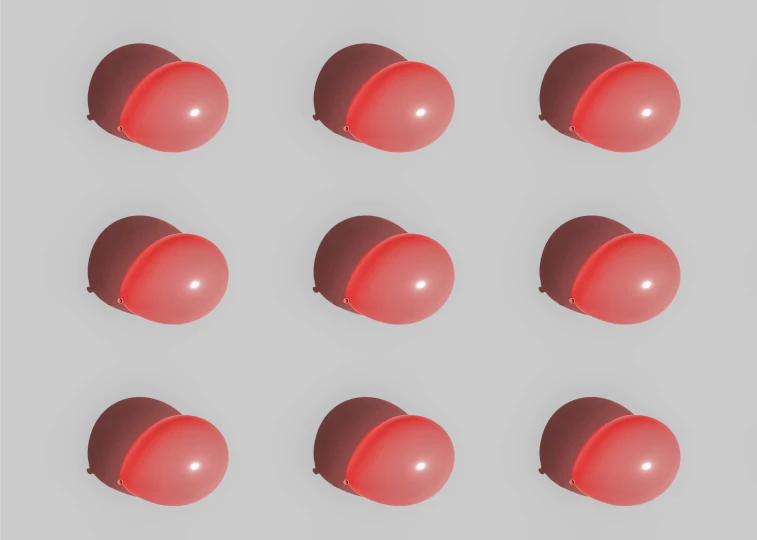 eight red spheres sitting side by side against a white background