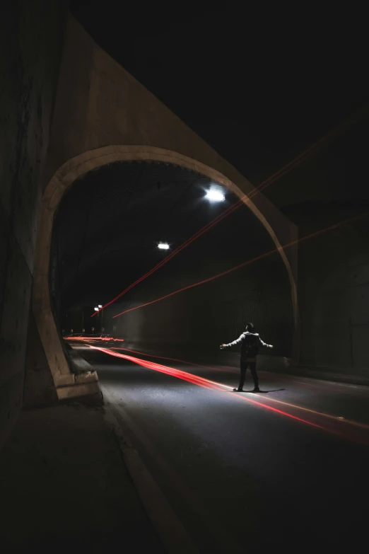 a man walks alone down the dark streets at night