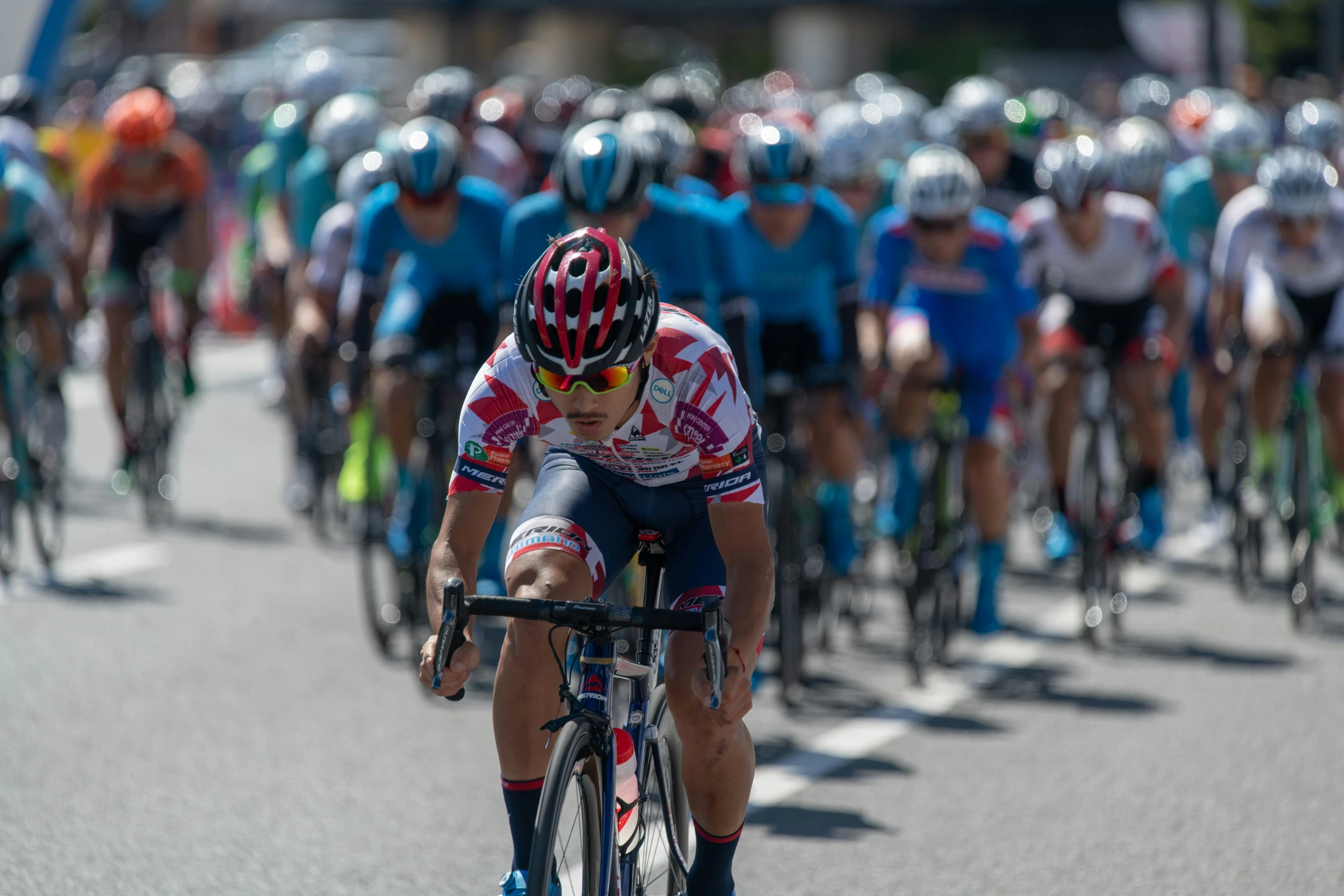 the bicyclist is starting in front of the crowd