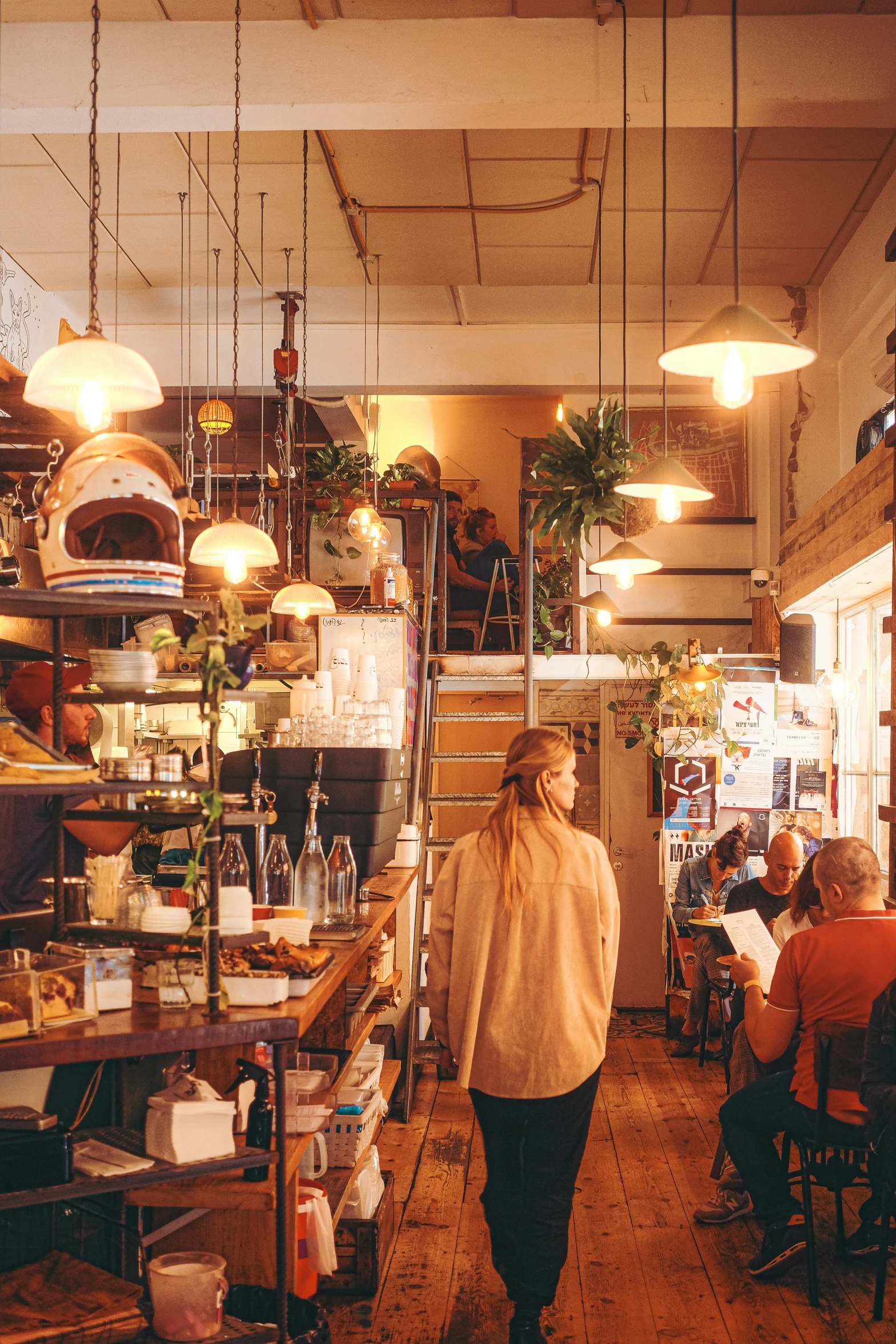 a woman walking down a wooden floor in a store