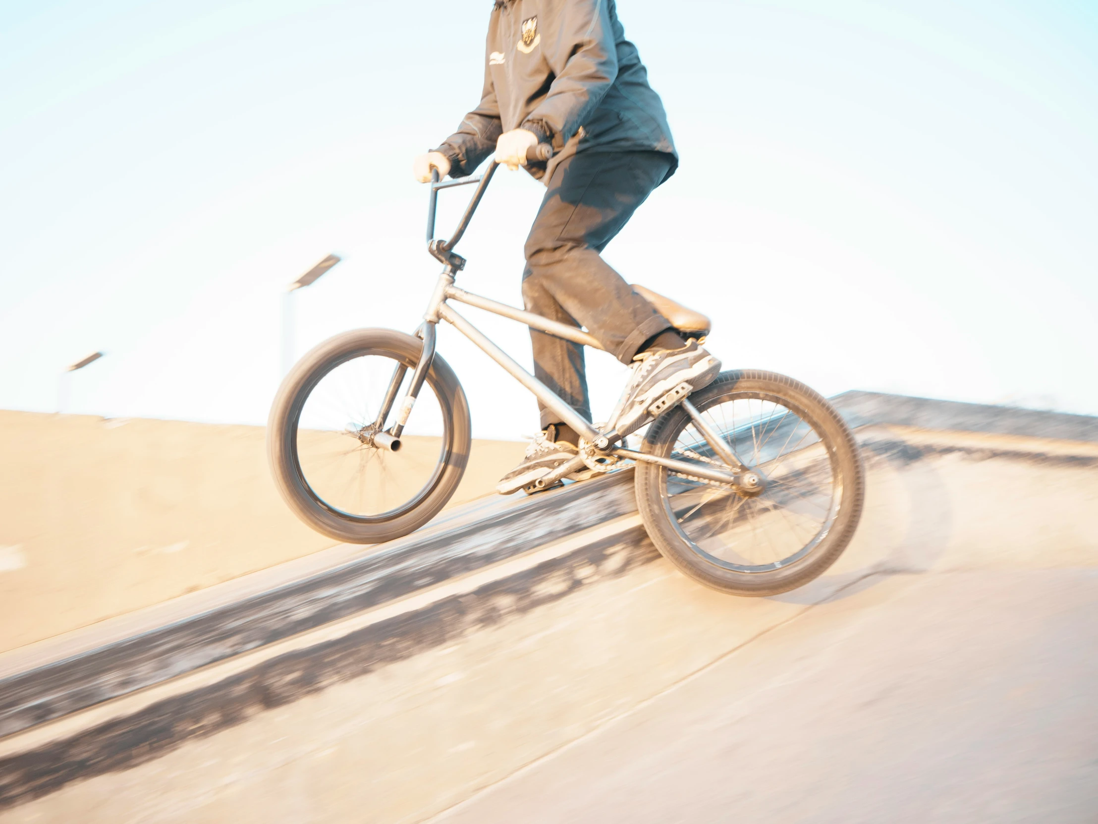 a man on a bike on the side of the road