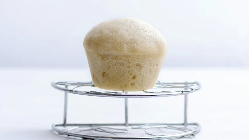 a close up of a pastry on a wire rack