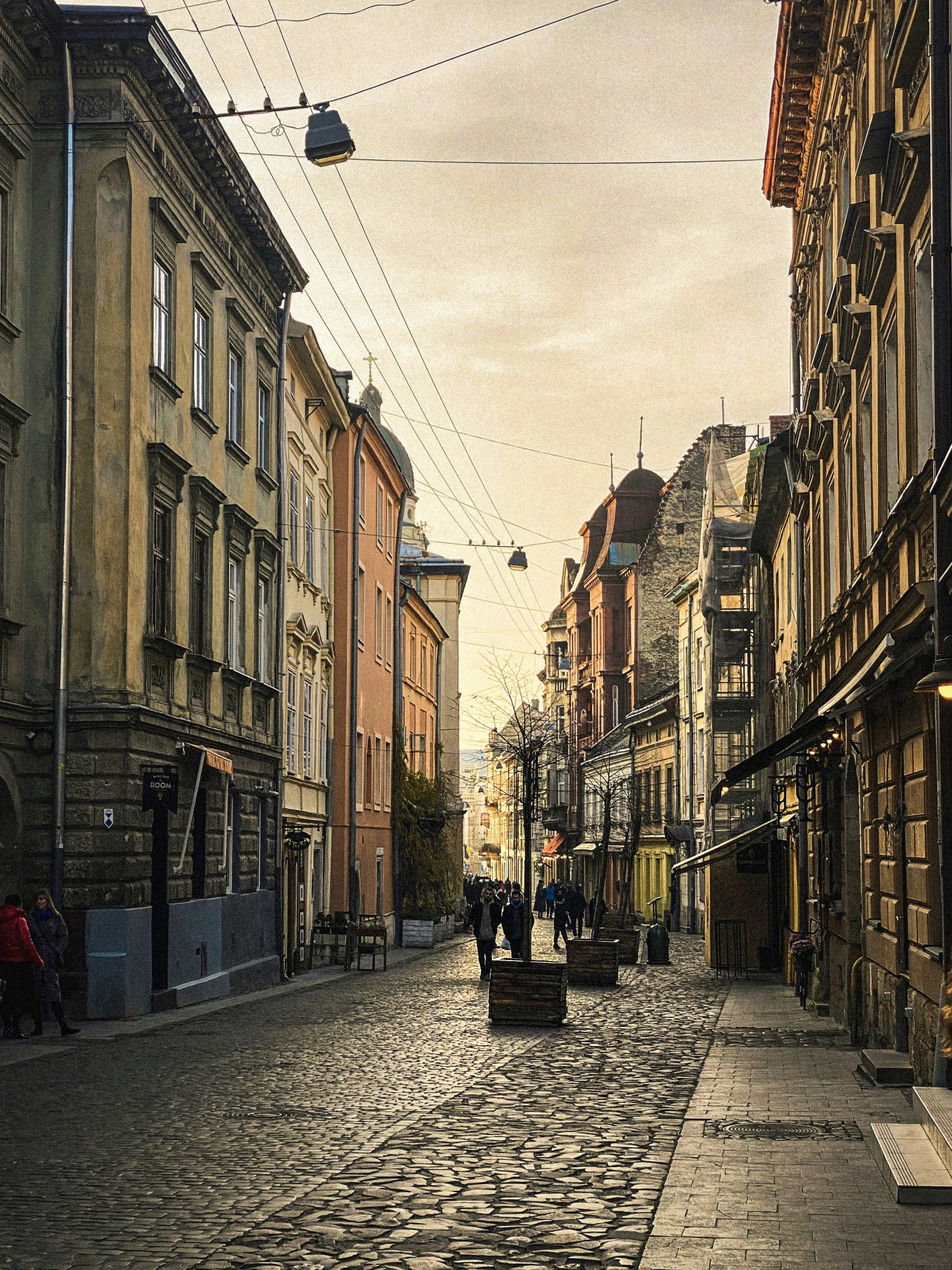 a old european street with cobblestone sidewalks