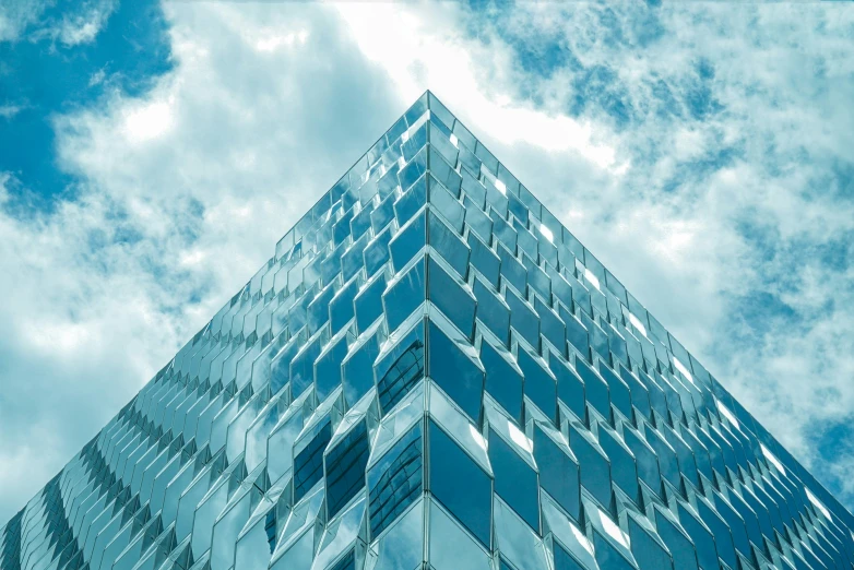 a glass building towering high in the sky