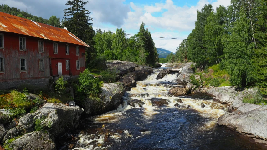 a small river running through the center of a rural town