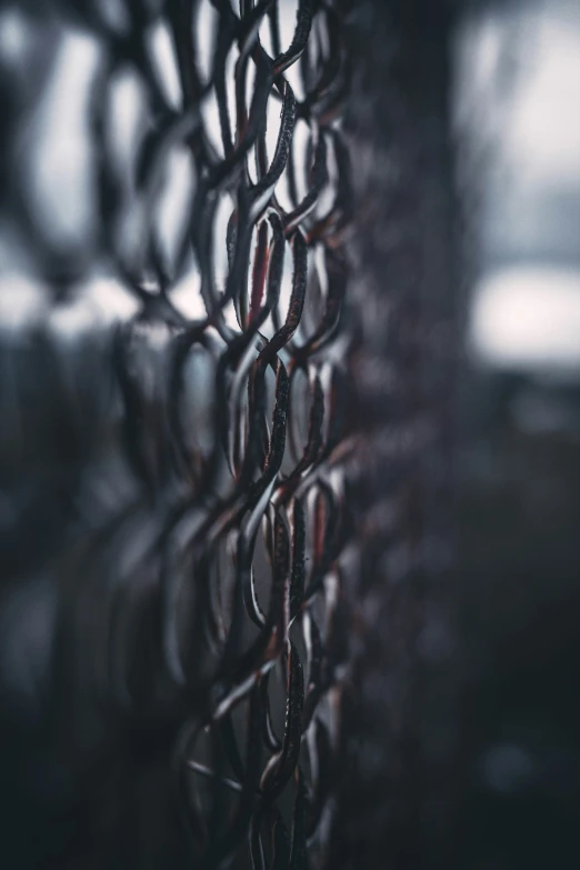 a wall with a chain link pattern hanging from the side