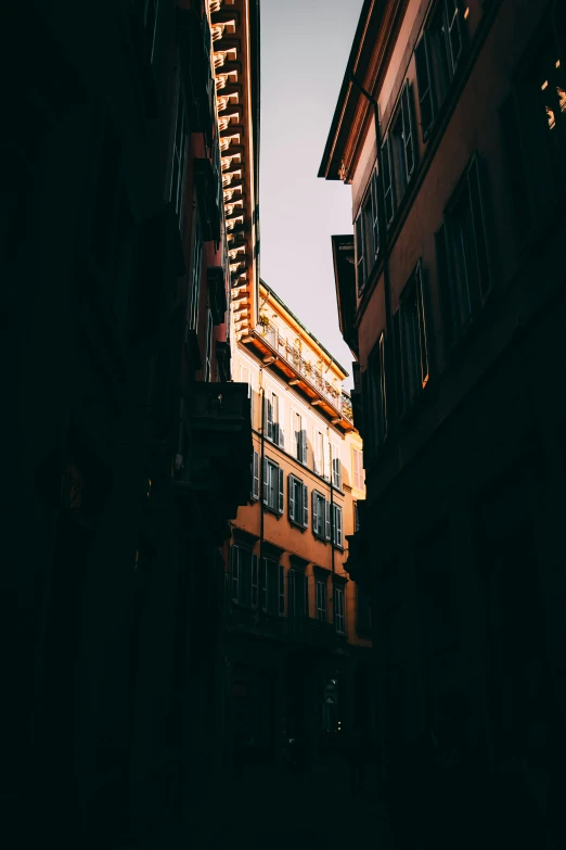 a street light with buildings in the background