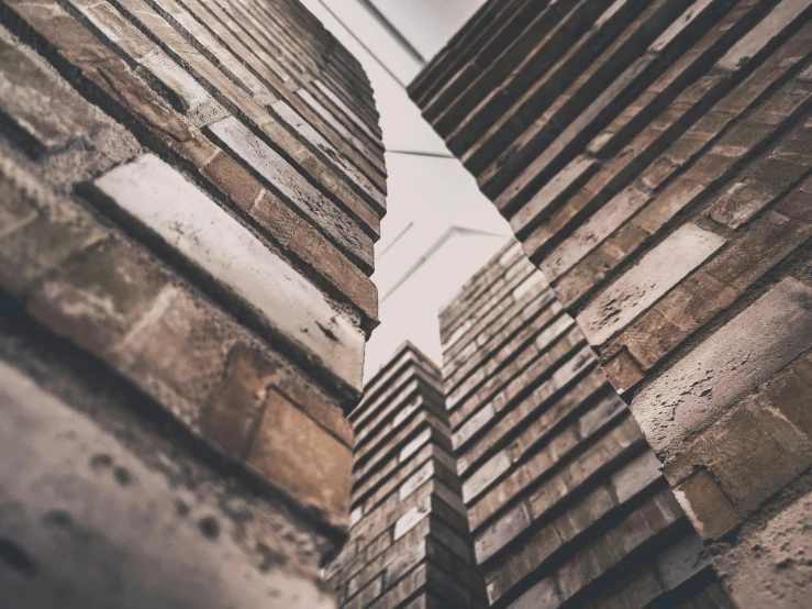 view of the brick building, upward into the sky