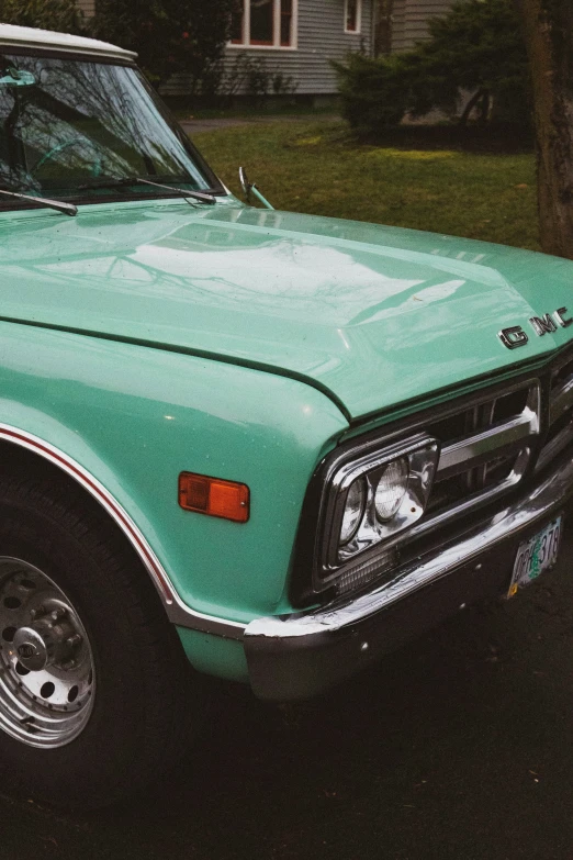 a close up of a parked truck in a driveway