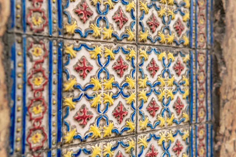 colorful tile in the form of flower designs on the walls