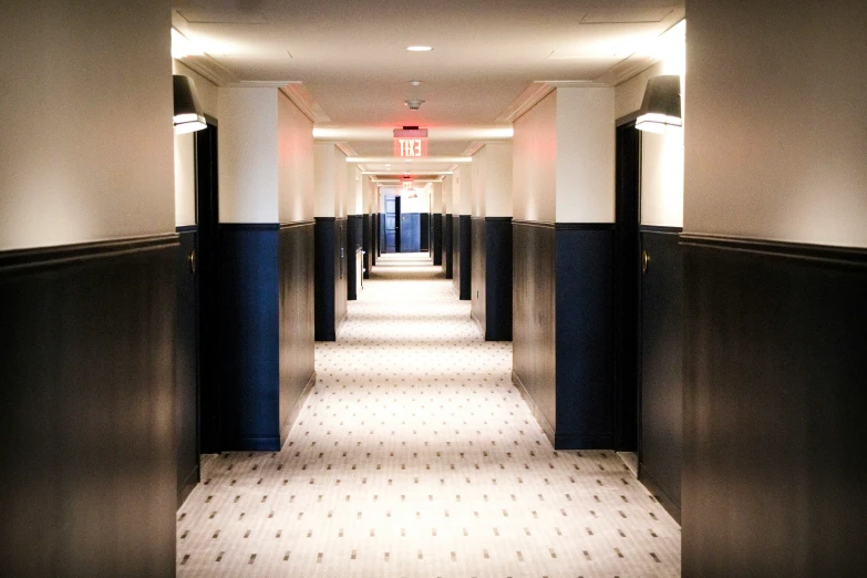 a long hallway with white and blue paint