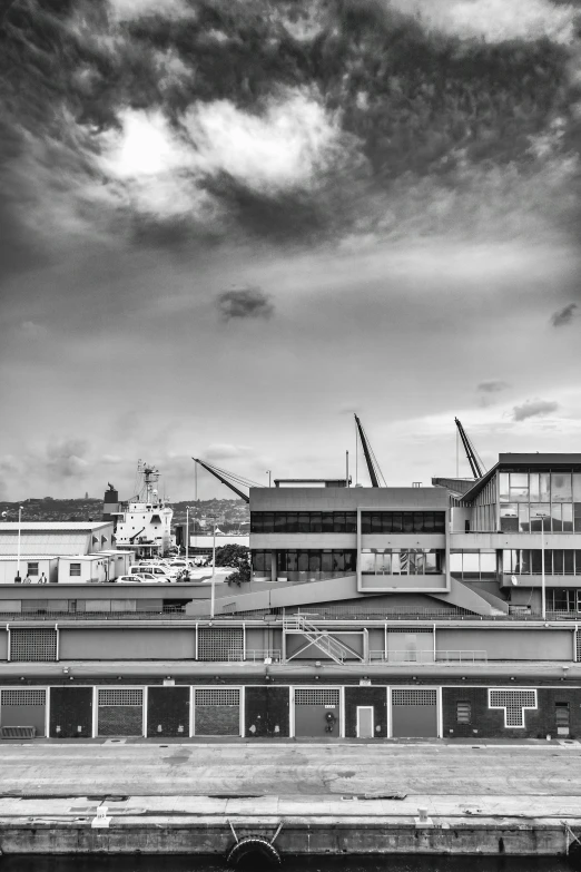 a city is shown with a cloudy sky and many buildings