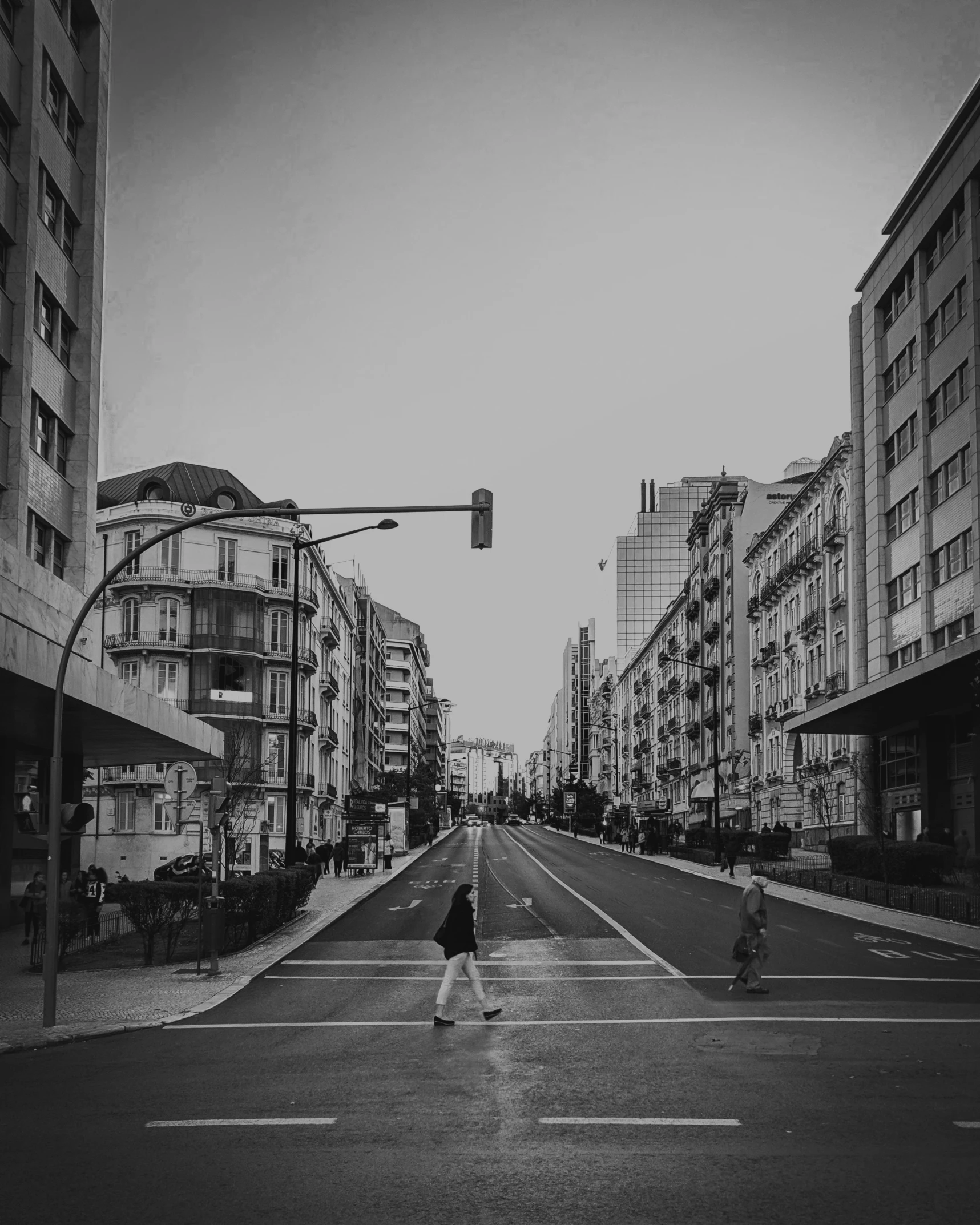 a man is crossing the road at an intersection