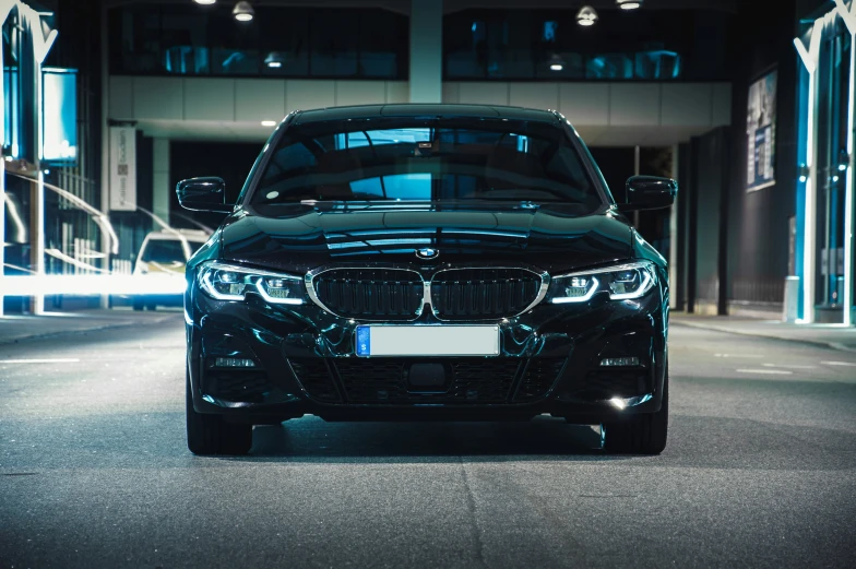 the black bmw e97 parked in a parking garage