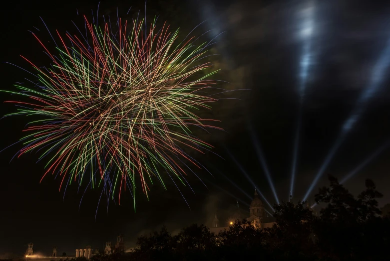 a fireworks is seen above a dark night sky