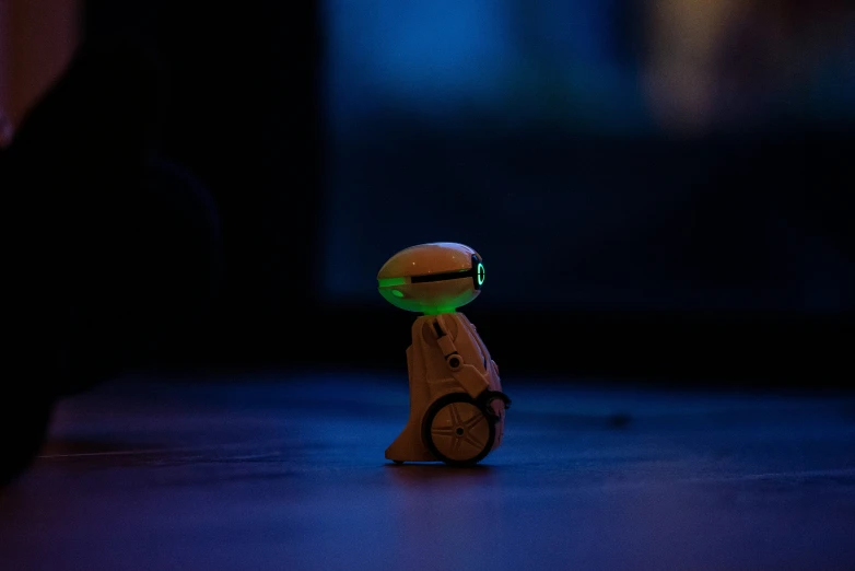 a toy is sitting on a floor in a dark room