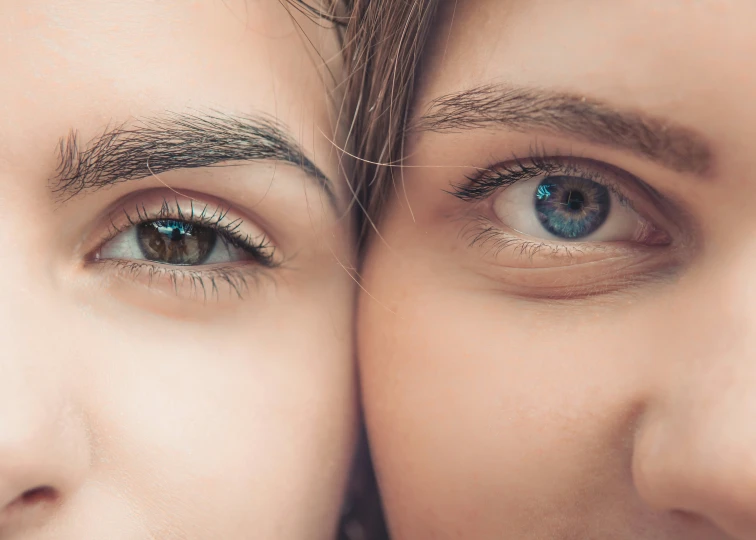 a close - up po shows the upper part of the eye and eyebrows of a couple