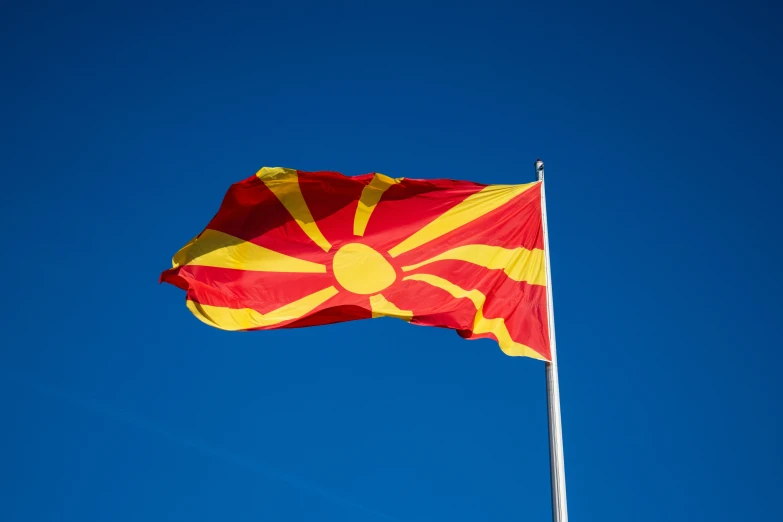 the arizona state flag flying high in the air