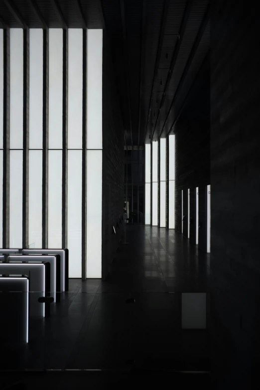 a dark room with a row of benches