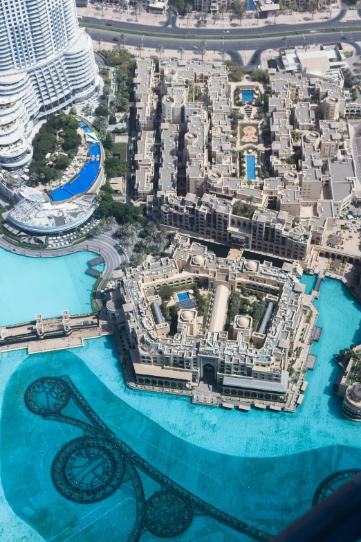 a building overlooking the city with a pool next to it