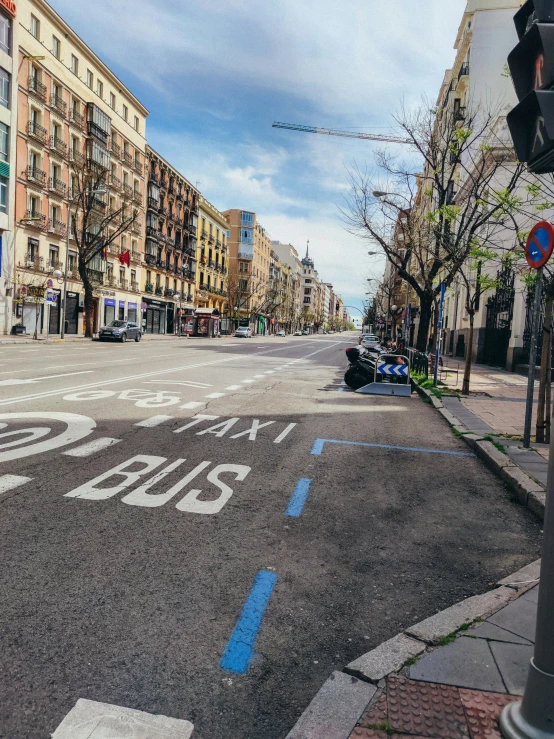 the intersection of a city street with a double yellow line painted on it