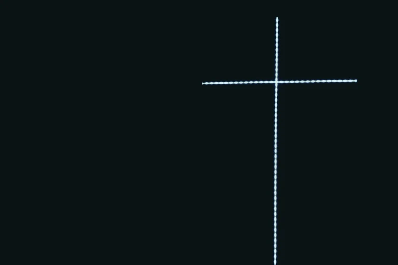 a cross with a long light painted on it