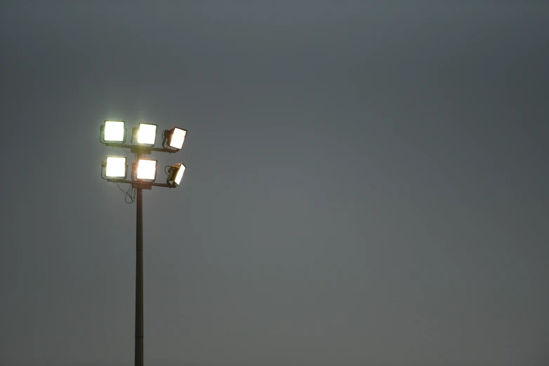 the square lamps stand out against the gray sky