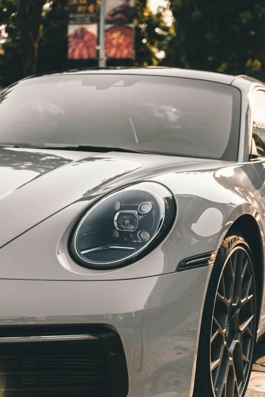 a gray car parked on the side of a road