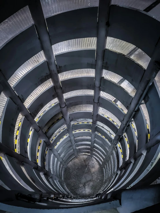 the ceiling of a building with a very large circular window