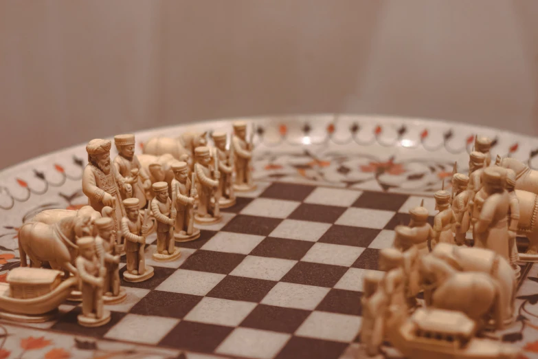 several wooden toy figurines on a chessboard