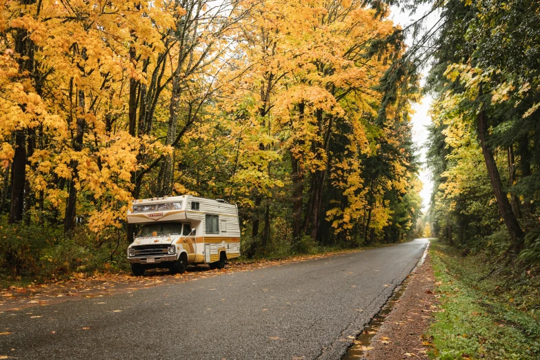 a motor home that has been parked along the road