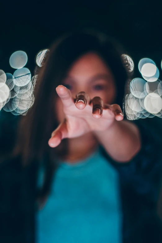 a close up of a person making a hand gesture