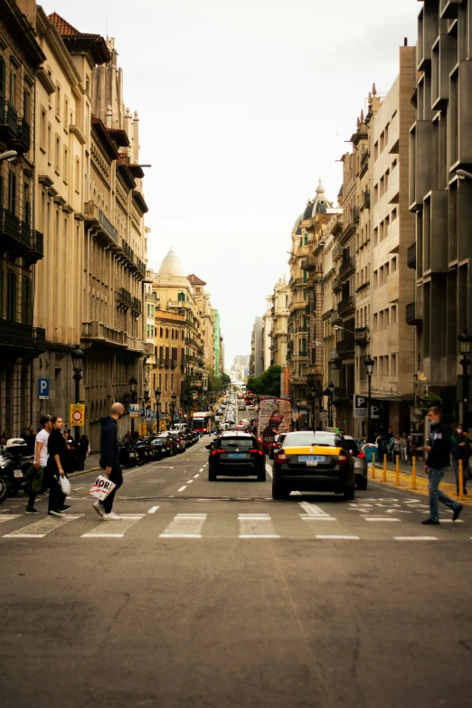 a city street filled with traffic and people