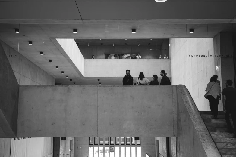 people are standing on the stairs at the top of some building