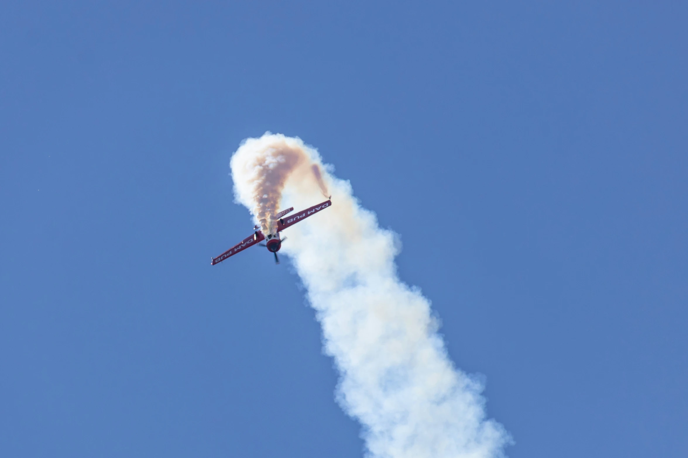 there is a jet that is flying sideways through the sky