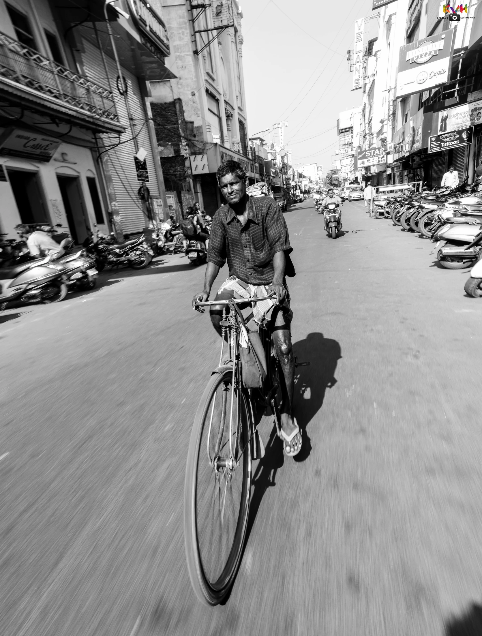 a man rides his bicycle through the city