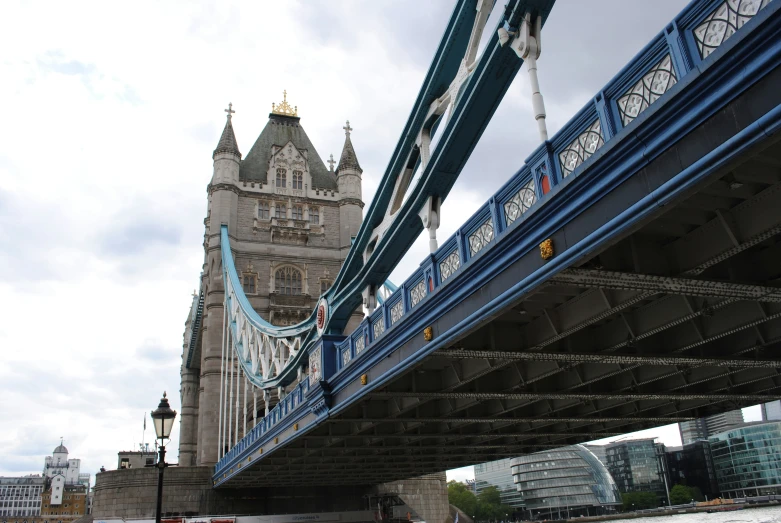 a long suspension bridge over a river with water