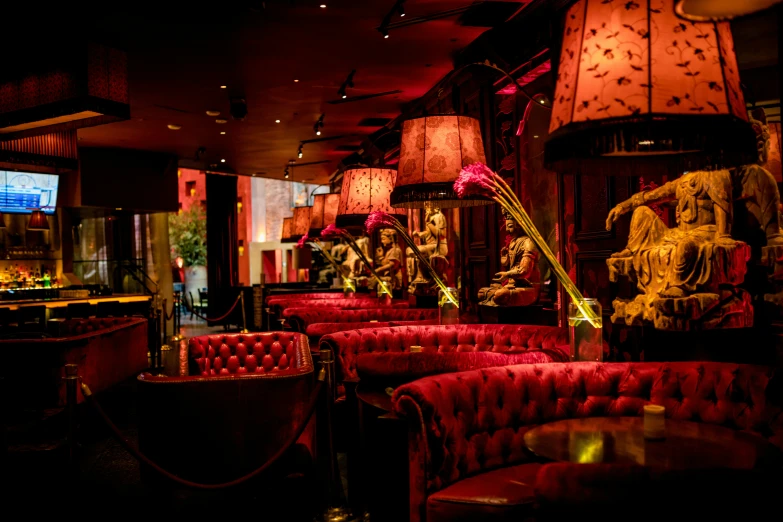 many red upholstered chairs in a restaurant