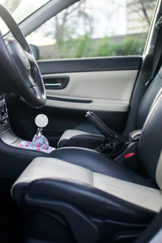 a car dashboard that has a steering wheel and an air vent