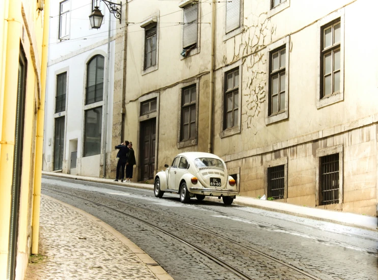 a couple of cars that are sitting in the street