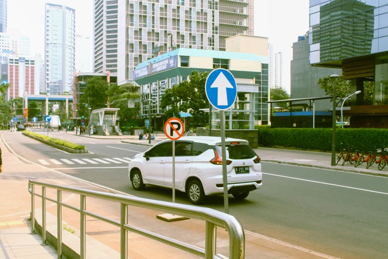 a city street filled with traffic and tall buildings