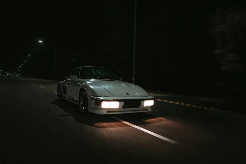 a car driving on a road at night