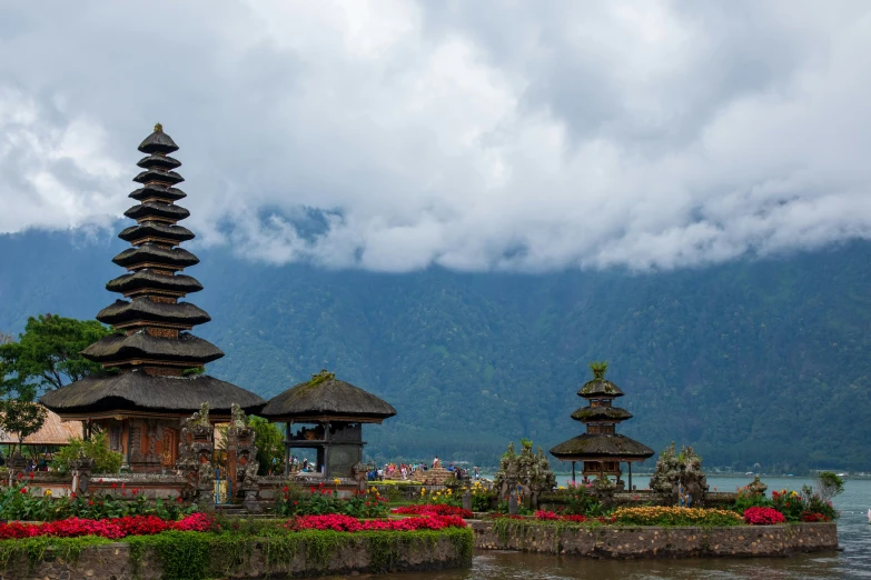 three asian style buildings with a pagoda in the background